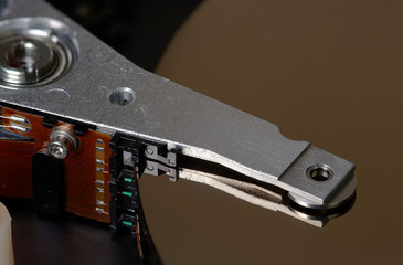 Reading head and computer hard drive, closeup.