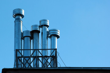 Metal chimneys on a roof
