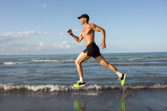 Sportsman running on the beach