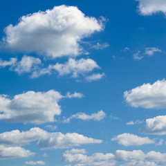 Naklejka na ściany i meble Blue sky, big and small clouds.
