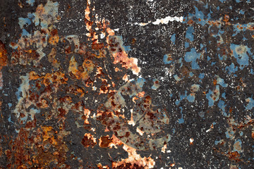 A background of peeling paint and rusty old metal
