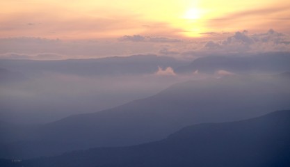 Sunset over mountains in cloudy day. View of Bowen Island from Bowen Lookout. Cypress Provincial Park, Vancouver, British Columbia, Canada 