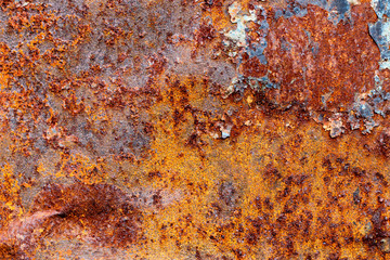 A background of peeling paint and rusty old metal