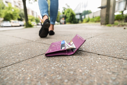 Close-up Of Woman Losing His Wallet