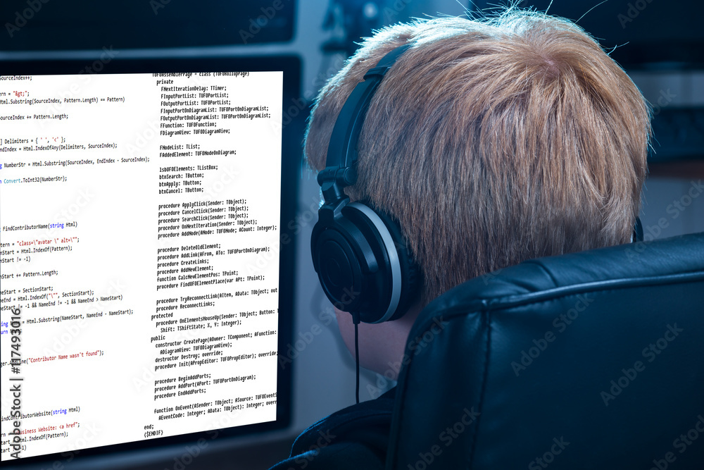 Poster boy working on computer