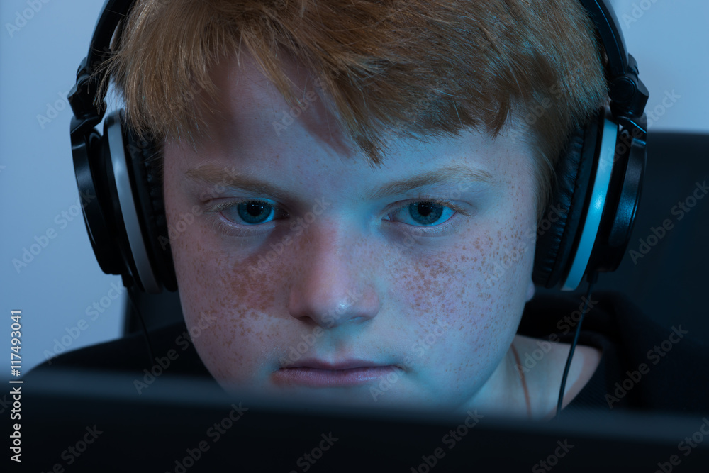 Poster boy working on computer
