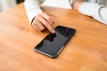 Woman using smart phone at home