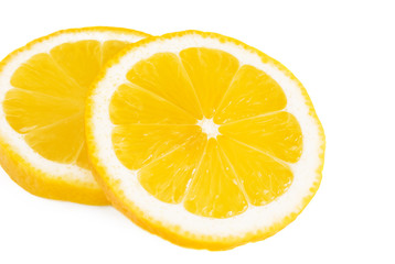 Fresh lemon slices isolated on white background.