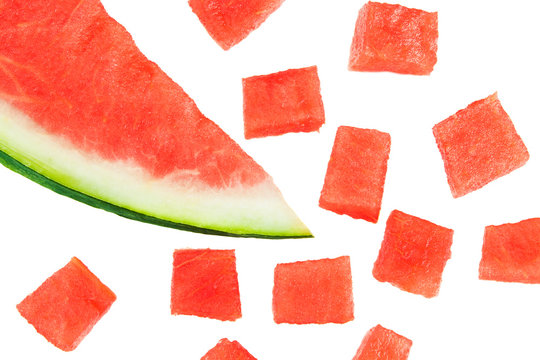 Fresh watermelon slice with cubic pieces isolated on white background.