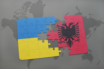 puzzle with the national flag of ukraine and albania on a world map background.