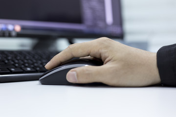 Close-up of male manager working on computer