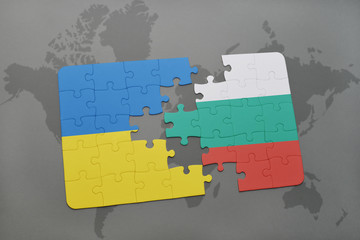 puzzle with the national flag of ukraine and bulgaria on a world map background.