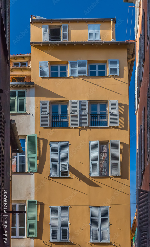 Wall mural Mediterranean house facade with ornate metal work in Nice, France