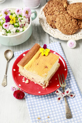 Piece of cheese cake and crunchy biscuits.