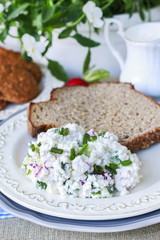 Bread and salad, oatmeal cookies and jug of milk.