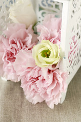 Vintage iron lantern with flowers inside