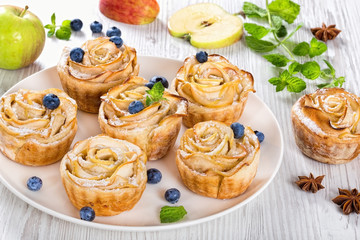 apple rose cake or cupcake and blueberry, top view