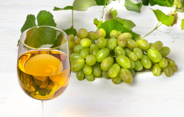 glass of white wine with grapes