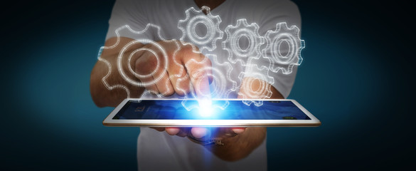 Businessman holding digital 3D engine