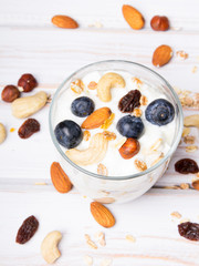 Healthy dessert with yogurt, nuts, oats and blueberries