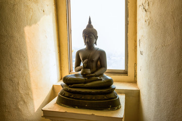 buddha statue with the window and light