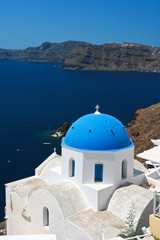 Fototapeta na wymiar Classic Santorini - Blue Roof Church, White Wash Walls Greece
