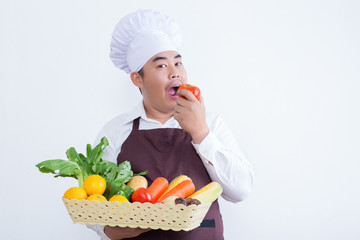 Portrait of a chef holding fruit and vegetable