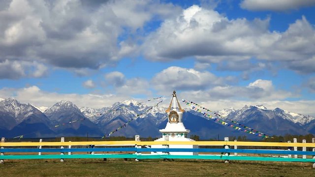 Buddhist stupa with colorful prayer flags 