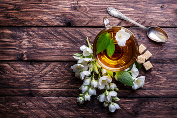 Glass cup of tea with jasmine