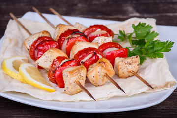 Tasty grilled meat and vegetables on skewer