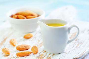almond essential oil and almond in bowl