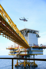 helicopter parking landing on offshore platform, Helicopter transfer crews or passenger to work in offshore oil and gas industry, air transportation for support passenger, ground service in airport.