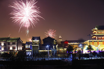 Fireworks up ancient buildings at night, in China