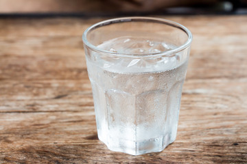 Iced water on wooden table 