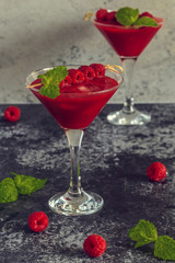 Red cocktail with raspberries.