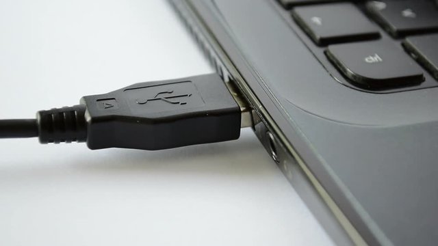 Plug / unplug USB cable to laptop.