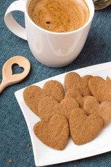 Cup of coffee and heart shaped cookies