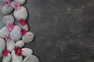 dark Spa background with pebbles and flowers