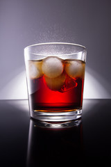 Cola with splash of ice cubes