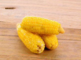 Ear of corn on the wooden table
