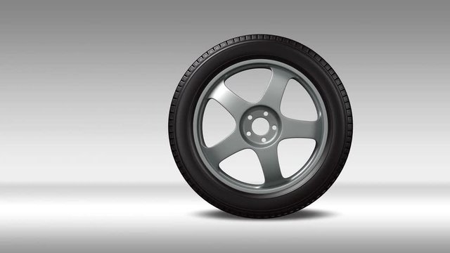 car wheel rolled into frame, stops, and rolls out, on a paved road and on a white background,  alpha matte