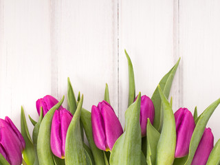 tulip bouquet on white wooden background