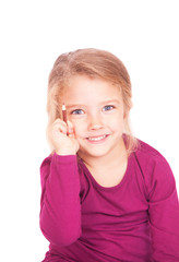 Portrait of a cute little girl with pencil in hand