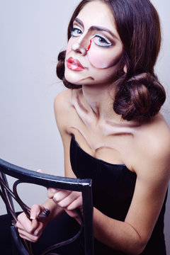 The girl with false eyelashes, make-up clown, mime image