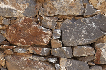 Wall from large stone textured basalt. Good background for wallpaper.