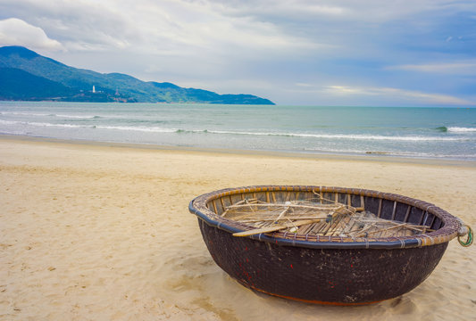 Mountains and Bamboo boat at China Beach Danang in Vietnam