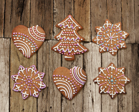 Christmas gingerbreads on old rough wood plank