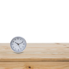 Circle clock on wood table isolated on white background