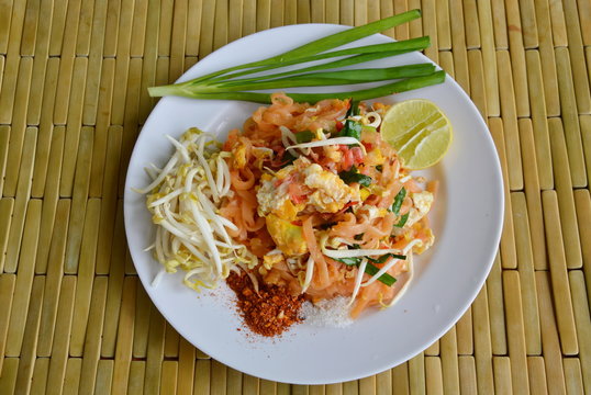 Pad Thai stir fried rice noodle with egg and vegetable on dish