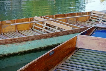 Close up of empty coloured punts on the River Cam, Cambridge, England.